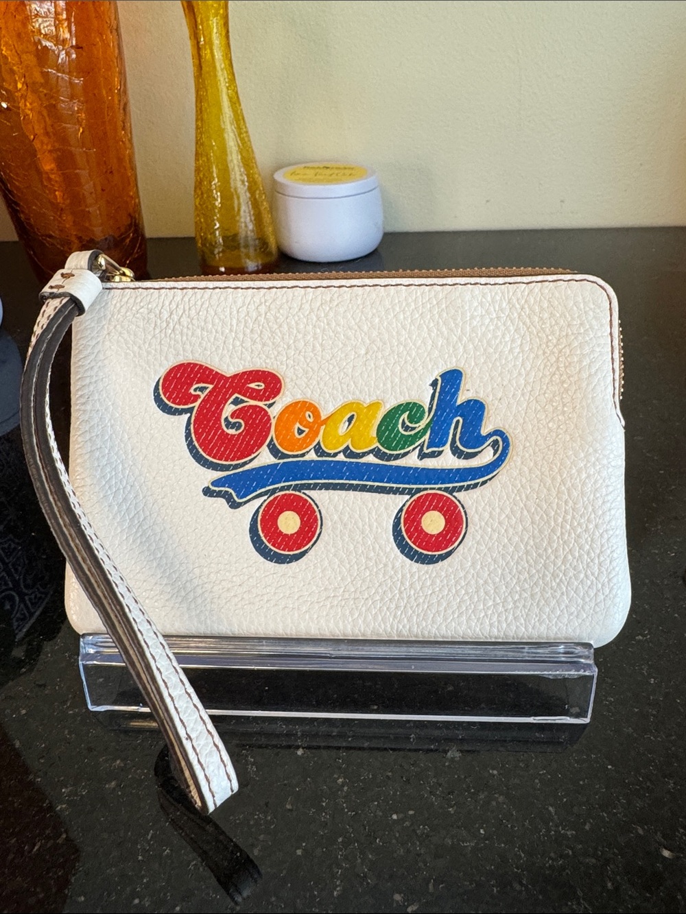 Coach White Pebbled Leather Wristlet with Rainbow Rollerskate Logo